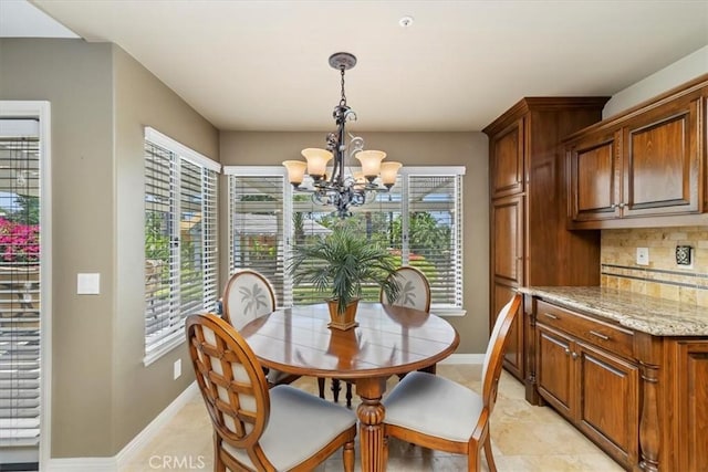 10847 Leota Ln, Riverside, CA 92503 - dining area with a chandelier and light tile patterned floors