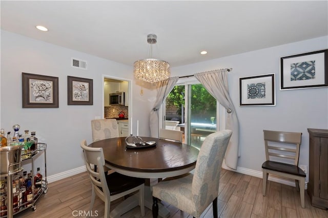 1335 N Vallejo Way, Upland, CA 91786 - dining room featuring light wood finished floors, a chandelier, and recessed lighting
