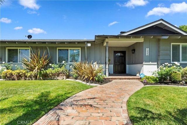 1335 N Vallejo Way, Upland, CA 91786 - view of front of home featuring board and batten siding and a front lawn