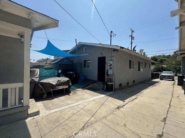 2132 Lincoln Park Ave, Lincoln Heights, CA 90031 - view of side of home with stucco siding