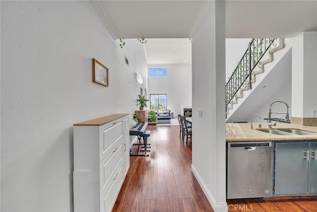 625 S Berendo St Unit 604, Los Angeles, CA 90005 - corridor featuring dark wood-type flooring, crown molding, and stairway