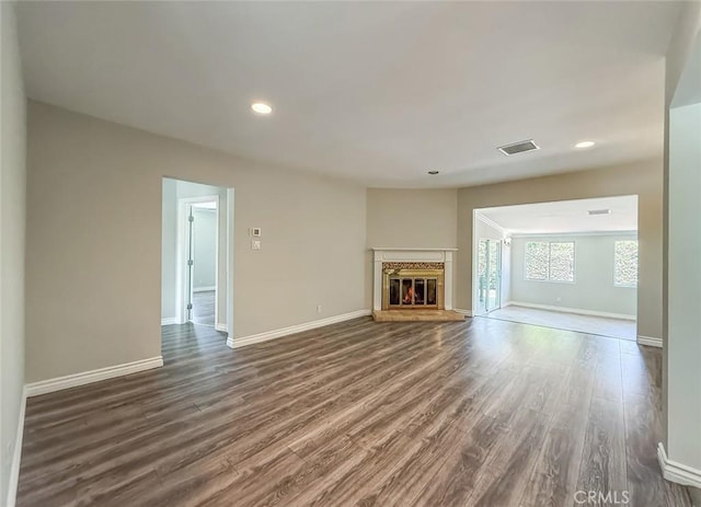 6706 Melvin Ave, Reseda, CA 91335 - unfurnished living room featuring wood finished floors, recessed lighting, and a glass covered fireplace