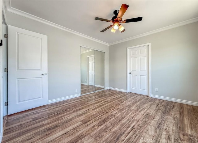 6706 Melvin Ave, Reseda, CA 91335 - unfurnished bedroom featuring wood finished floors, a closet, ornamental molding, and ceiling fan