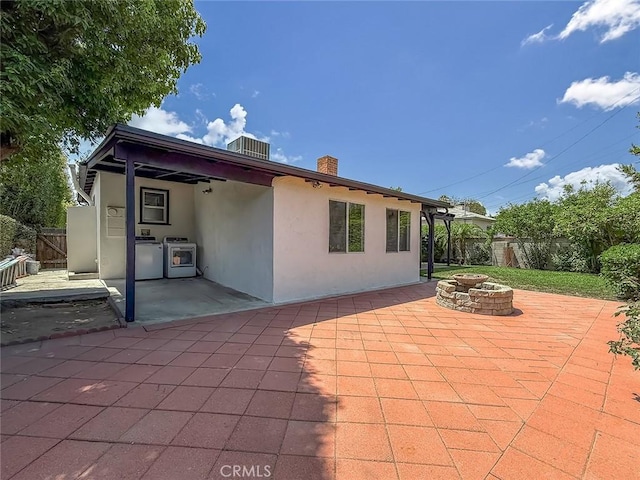 6706 Melvin Ave, Reseda, CA 91335 - rear view of property with a fire pit, stucco siding, a patio, and a chimney