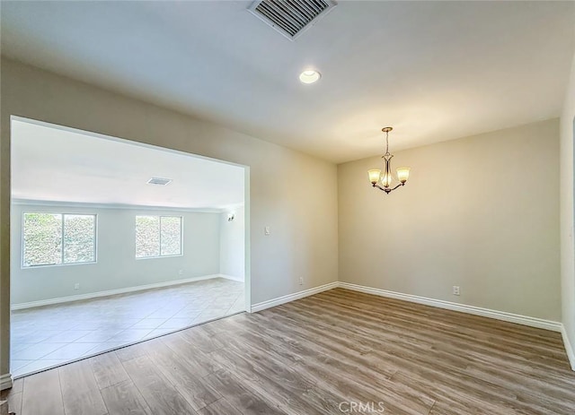 6706 Melvin Ave, Reseda, CA 91335 - empty room featuring a chandelier, wood finished floors, and recessed lighting