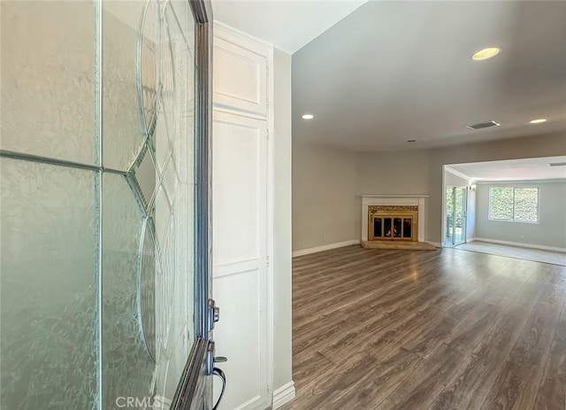 6706 Melvin Ave, Reseda, CA 91335 - unfurnished living room with wood finished floors, recessed lighting, and a glass covered fireplace