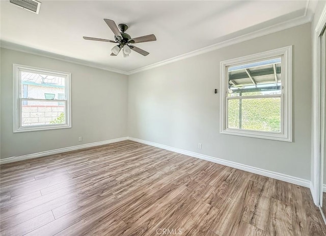 6706 Melvin Ave, Reseda, CA 91335 - empty room with wood finished floors, ornamental molding, and a ceiling fan