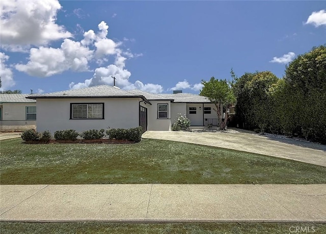 6706 Melvin Ave, Reseda, CA 91335 - ranch-style home with stucco siding, an attached garage, driveway, a front lawn, and covered porch