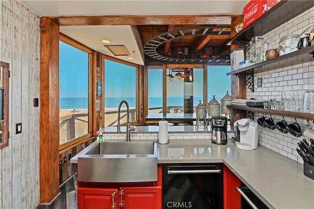 1 Anderson St, Seal Beach, CA 90743 - kitchen with backsplash, dishwasher, light countertops, a water view, and open shelves