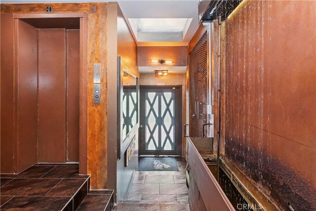 1 Anderson St, Seal Beach, CA 90743 - doorway featuring elevator and stone finish floors