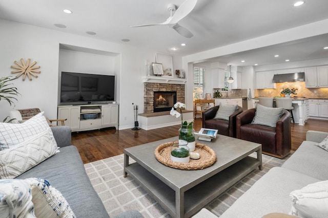 3474 Camino Cereza, Carlsbad, CA 92009 - living area featuring wood finished floors, a ceiling fan, recessed lighting, and a fireplace