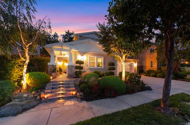3474 Camino Cereza, Carlsbad, CA 92009 - view of front of house featuring driveway, stone siding, and a garage
