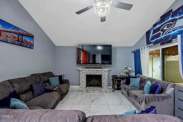 502 Holly Ave, Oxnard, CA 93036 - living room featuring vaulted ceiling, marble finish floors, ceiling fan, and a stone fireplace