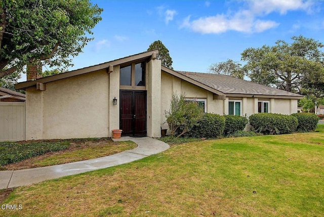 502 Holly Ave, Oxnard, CA 93036 - mid-century modern home with a front yard, stucco siding, and a chimney