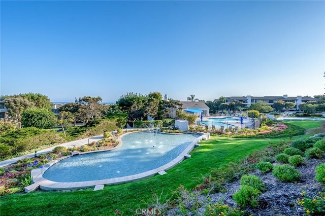 100 Scholz Plz Unit 205, Newport Beach, CA 92663 - outdoor pool featuring a putting area and a yard