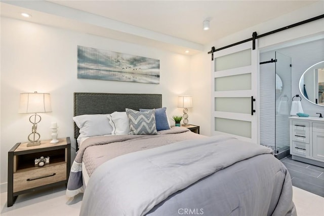 100 Scholz Plz Unit 205, Newport Beach, CA 92663 - bedroom featuring a barn door and recessed lighting
