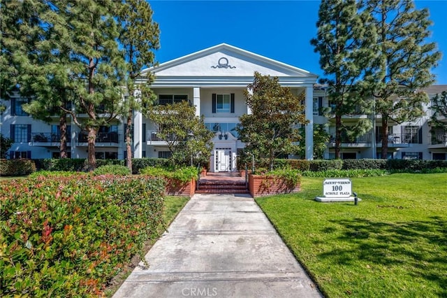 100 Scholz Plz Unit 205, Newport Beach, CA 92663 - view of front of home with a front lawn and stucco siding
