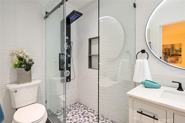 100 Scholz Plz Unit 205, Newport Beach, CA 92663 - full bathroom featuring vanity, a shower stall, and tile walls