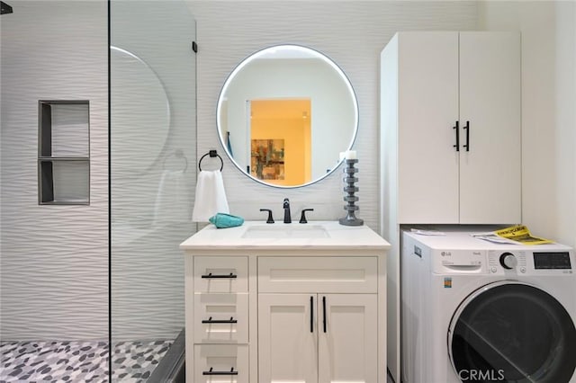 100 Scholz Plz Unit 205, Newport Beach, CA 92663 - laundry area with washer / clothes dryer and cabinet space