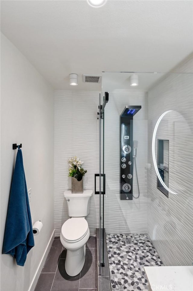 100 Scholz Plz Unit 205, Newport Beach, CA 92663 - bathroom featuring a shower stall and tile patterned flooring