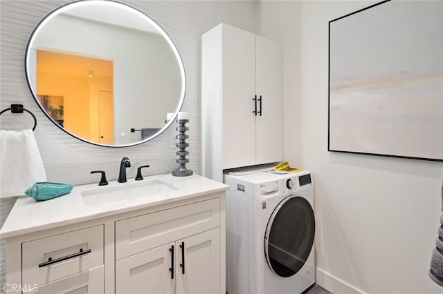 100 Scholz Plz Unit 205, Newport Beach, CA 92663 - laundry area featuring washer / clothes dryer and cabinet space
