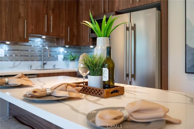 100 Scholz Plz Unit 205, Newport Beach, CA 92663 - kitchen with high end refrigerator and backsplash