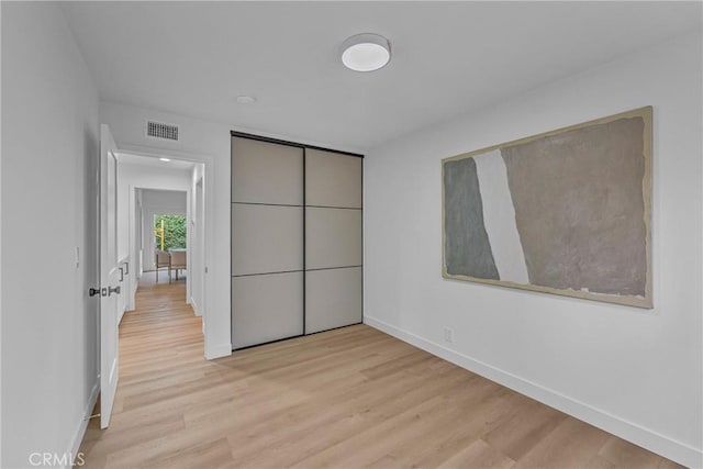 20441 Whitetree Cir, Huntington Beach, CA 92646 - unfurnished bedroom featuring light wood-type flooring and a closet