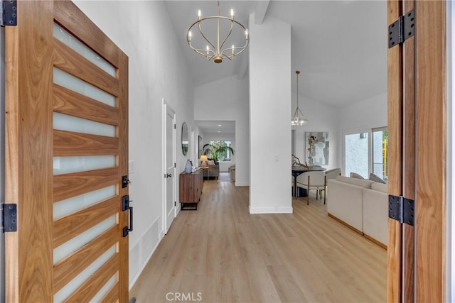 20441 Whitetree Cir, Huntington Beach, CA 92646 - foyer featuring a chandelier, light wood-type flooring, and high vaulted ceiling