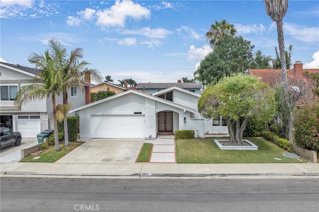 20441 Whitetree Cir, Huntington Beach, CA 92646 - view of front of house with driveway, an attached garage, stucco siding, a front yard, and french doors