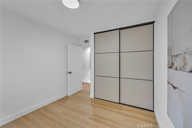 20441 Whitetree Cir, Huntington Beach, CA 92646 - unfurnished bedroom featuring wood finished floors and a closet