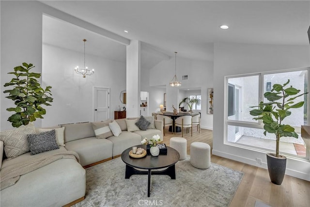20441 Whitetree Cir, Huntington Beach, CA 92646 - living area with high vaulted ceiling, light wood-style floors, a chandelier, and recessed lighting