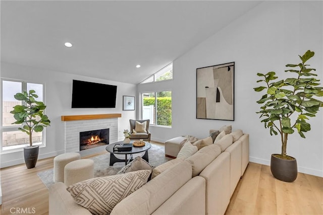 20441 Whitetree Cir, Huntington Beach, CA 92646 - living area featuring a fireplace with flush hearth, light wood-type flooring, recessed lighting, and high vaulted ceiling