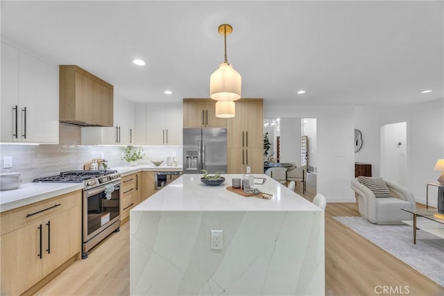 20441 Whitetree Cir, Huntington Beach, CA 92646 - kitchen with stainless steel appliances, light wood-style flooring, a center island, recessed lighting, and decorative backsplash
