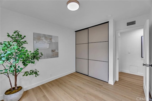 20441 Whitetree Cir, Huntington Beach, CA 92646 - unfurnished bedroom featuring light wood-style floors and baseboards