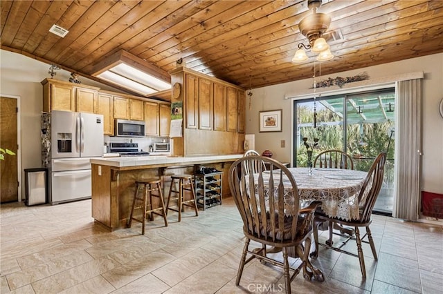 7050 Shale Rock Rd, Paso Robles, CA 93446 - dining area featuring wooden ceiling, vaulted ceiling, and light stone finish flooring