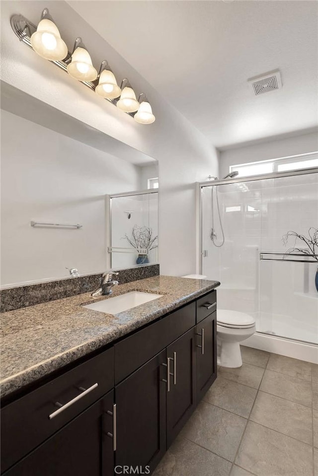 15558 Lookout Rd, Apple Valley, CA 92307 - full bathroom with vanity, a shower stall, and tile patterned floors