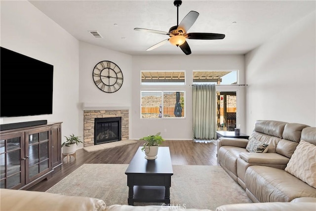 15558 Lookout Rd, Apple Valley, CA 92307 - living room with a ceiling fan, wood finished floors, and a fireplace