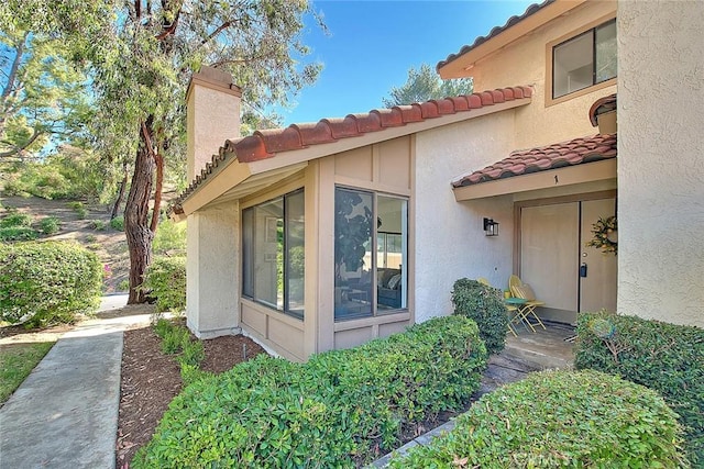 1207 Porto Grande Unit 1, Diamond Bar, CA 91765 - view of side of home with a tiled roof and stucco siding