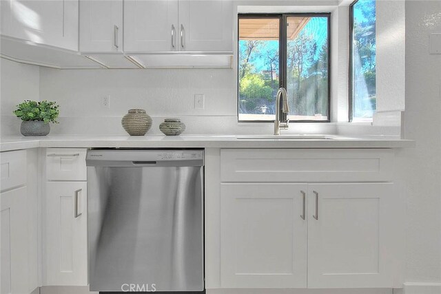 1207 Porto Grande Unit 1, Diamond Bar, CA 91765 - kitchen with dishwasher, white cabinets, and light countertops
