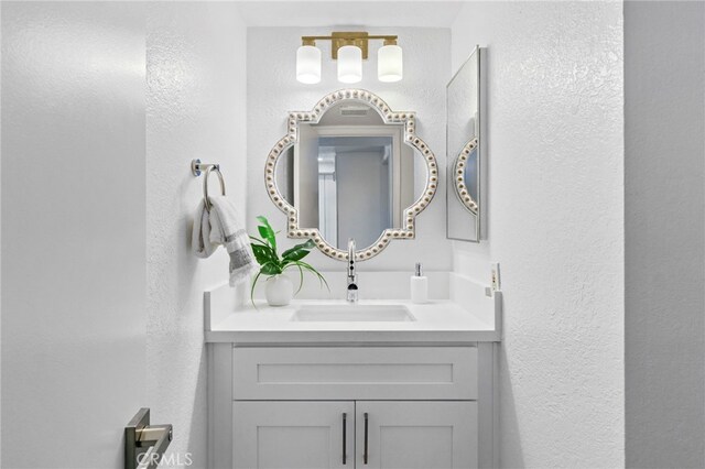 1207 Porto Grande Unit 1, Diamond Bar, CA 91765 - bathroom featuring a textured wall and vanity
