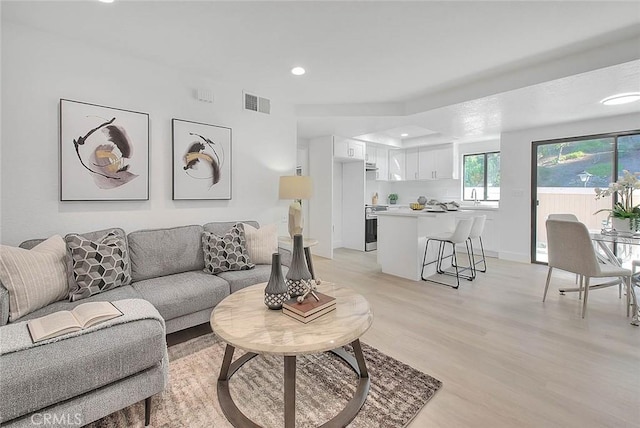 1207 Porto Grande Unit 1, Diamond Bar, CA 91765 - living room with recessed lighting and light wood finished floors