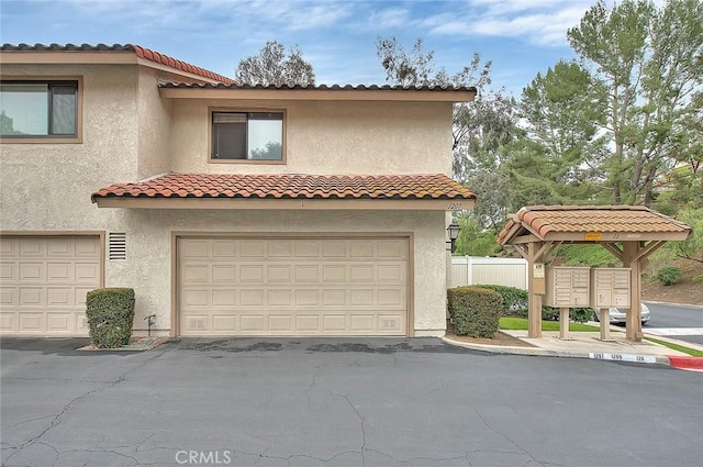 1207 Porto Grande Unit 1, Diamond Bar, CA 91765 - mediterranean / spanish home featuring stucco siding, an attached garage, and a tile roof