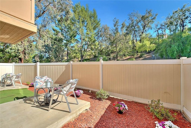 1207 Porto Grande Unit 1, Diamond Bar, CA 91765 - view of patio featuring outdoor dining area and view of wooded area