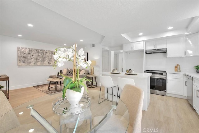 1207 Porto Grande Unit 1, Diamond Bar, CA 91765 - dining area featuring light wood-style flooring and recessed lighting