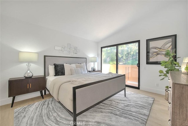 1207 Porto Grande Unit 1, Diamond Bar, CA 91765 - bedroom featuring access to outside, lofted ceiling, and light wood finished floors
