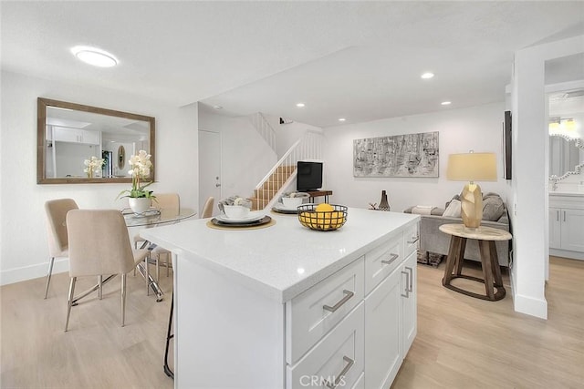 1207 Porto Grande Unit 1, Diamond Bar, CA 91765 - kitchen featuring open floor plan, light wood-type flooring, white cabinetry, light countertops, and recessed lighting