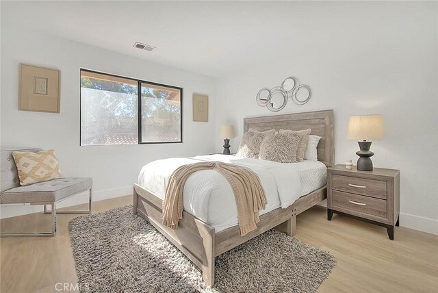 1207 Porto Grande Unit 1, Diamond Bar, CA 91765 - bedroom with light wood-type flooring and baseboards