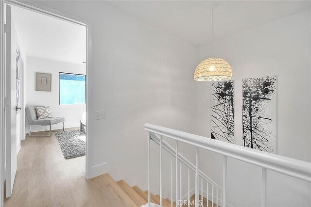 1207 Porto Grande Unit 1, Diamond Bar, CA 91765 - hall featuring an upstairs landing and light wood-style floors