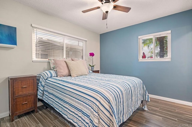 2722 Penkea Dr, Oceanside, CA 92054 - bedroom featuring multiple windows, wood finish floors, a textured ceiling, and a ceiling fan