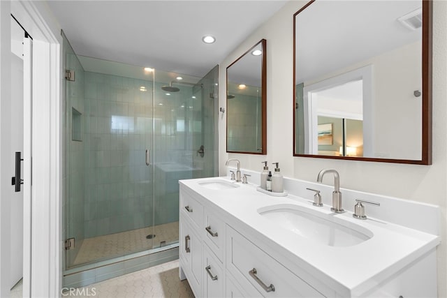 30361 Via Alcazar Ave, Laguna Niguel, CA 92677 - bathroom featuring double vanity, a shower stall, tile patterned floors, and recessed lighting